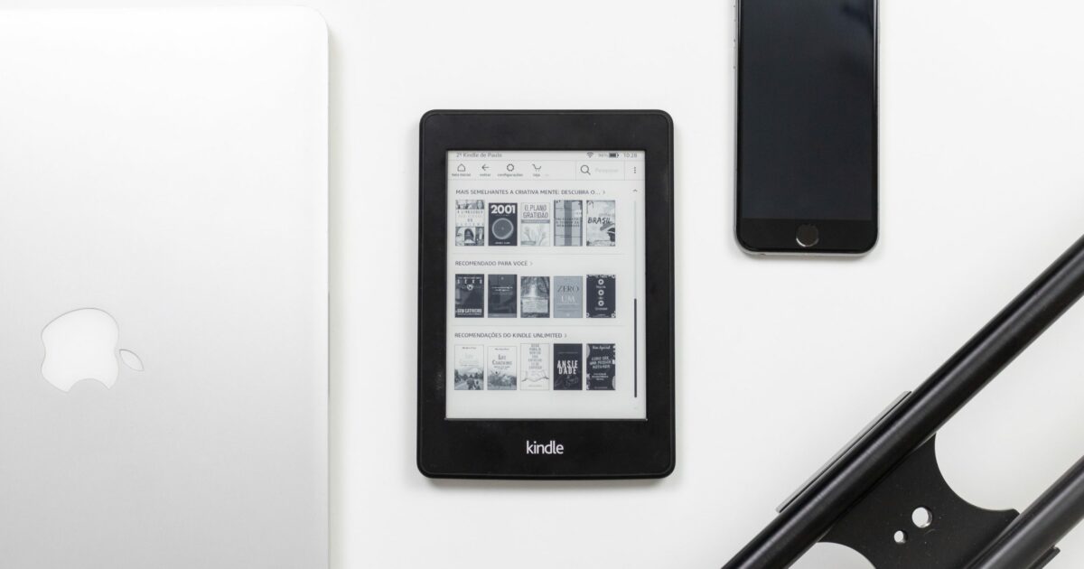 black Amazon Kindle e-book reader on white surface